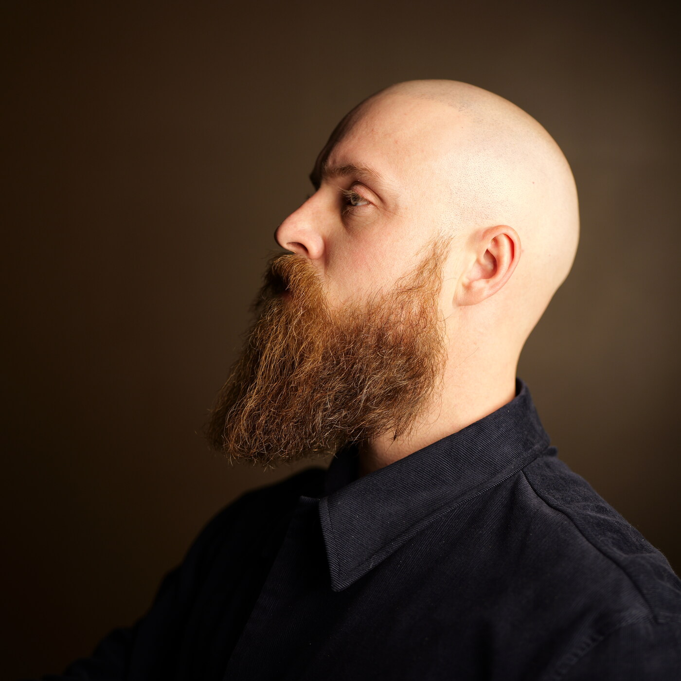 Portrait of Tate, founder of Oversoul, in profile